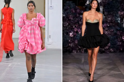 Dos modelos en la pasarela con vestidos.